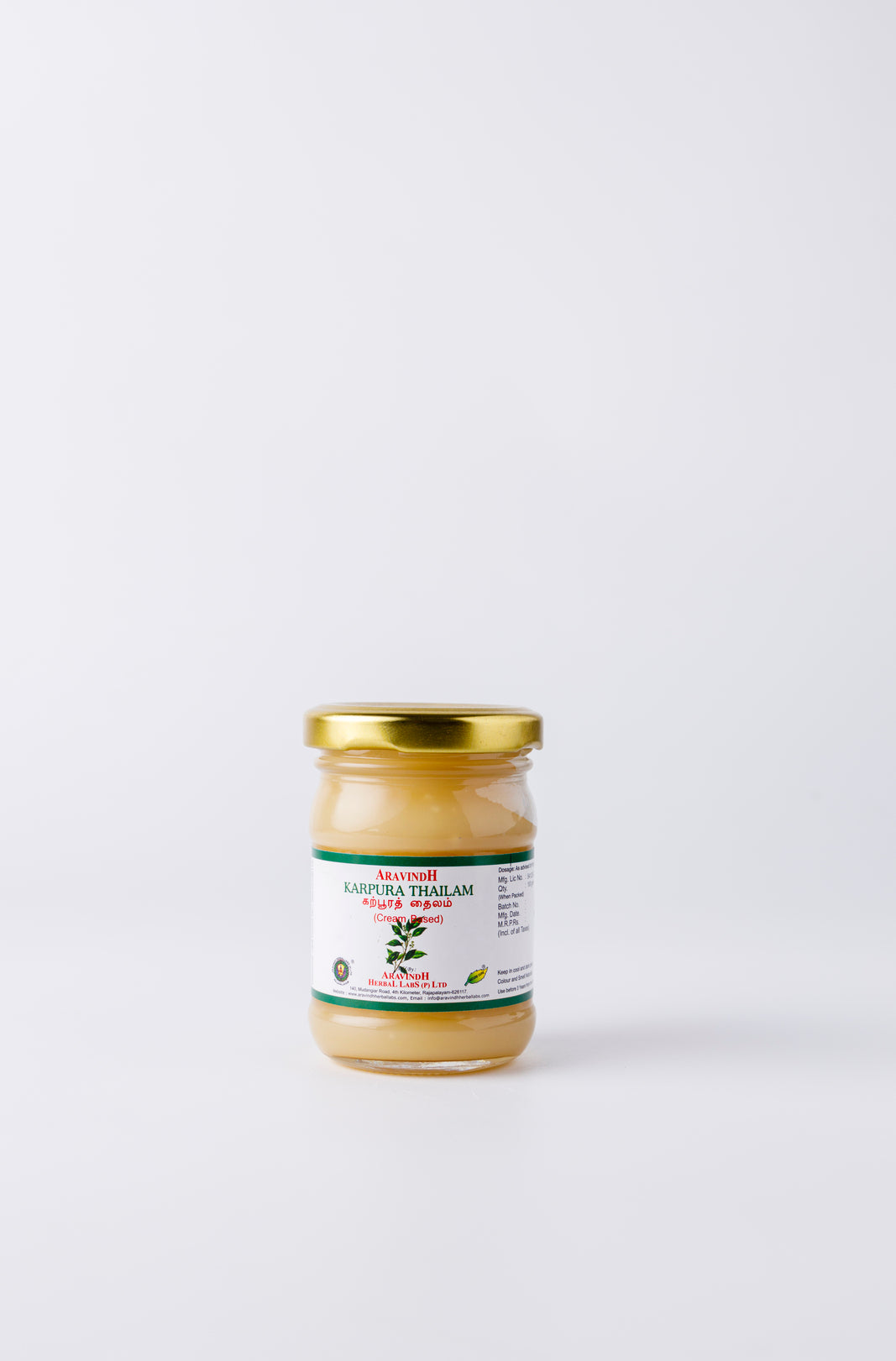Bottle of Karpoorathi Thylam (wax-based)