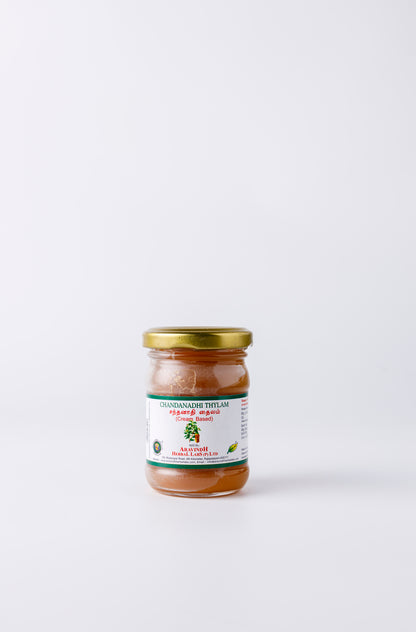 Bottle of Chandanathi Thylam (wax-based)